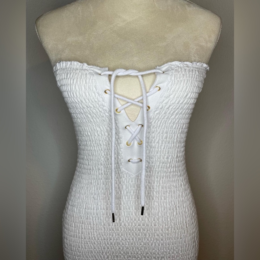 White guess mini tube dress with lace up detail on the front!